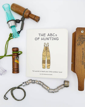 Collection of hunting-themed items including a book titled 'The ABCs of Hunting' on a white background.