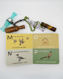 Card with bird illustrations and hunting-related text, accompanied by hunting call tools on a white background.