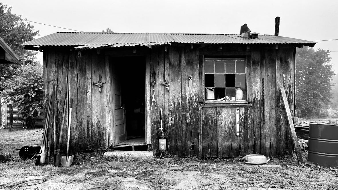 The original office for the sawmill still stands and is being used for storage. The dimensions are roughly 8'x14' with rough sawn White Oak board and batten wood siding.