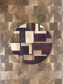 Wooden cutting board with geometric pattern on a wooden surface