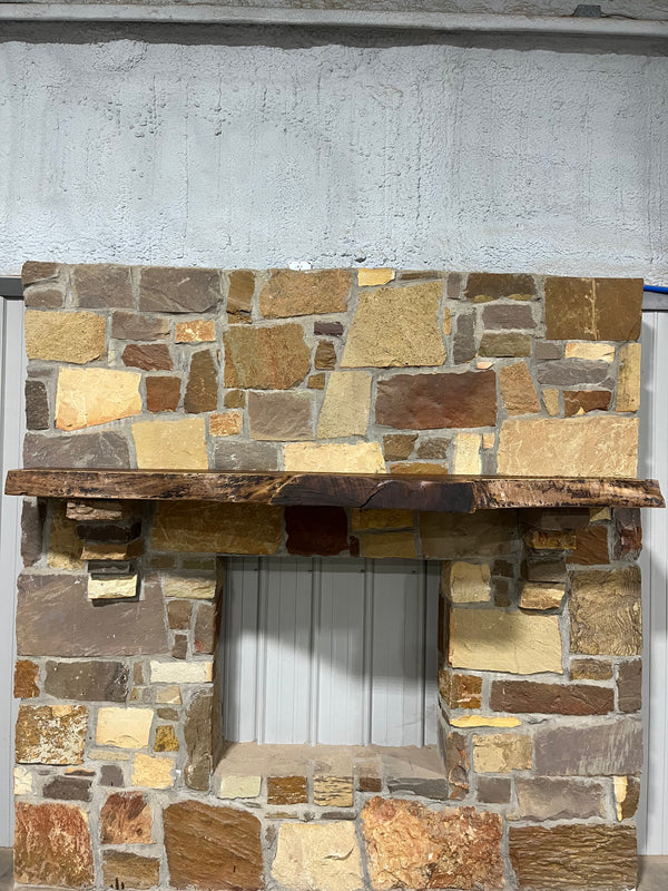 Front view of the live edge of a beautifully, rustic, fireplace walnut mantel