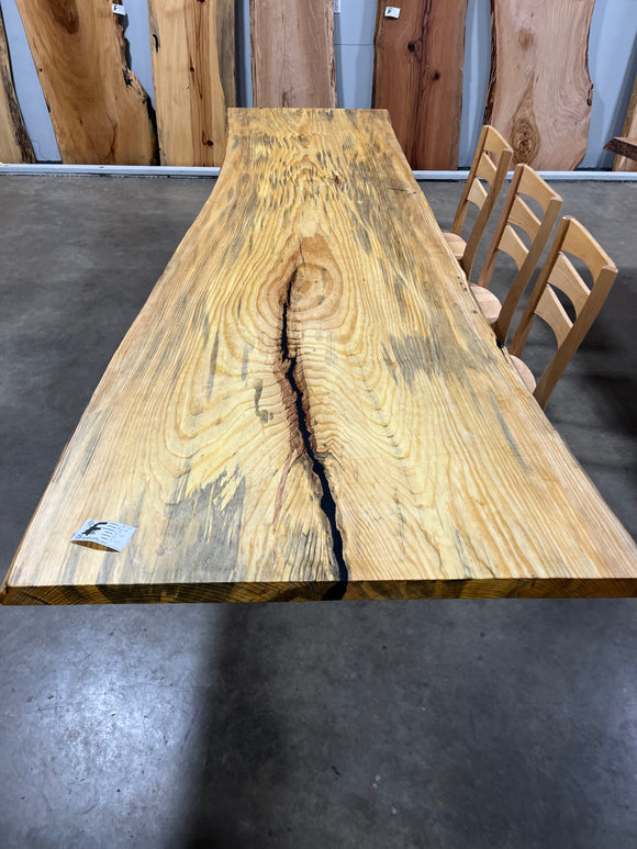 Finished live edge blue pine slab with natural grain and blue-gray streaks
