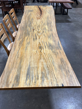 Finished live edge blue pine slab with natural grain and blue-gray streaks
