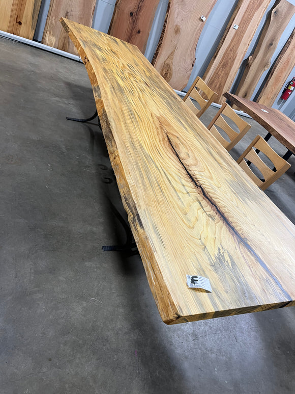 Finished live edge blue pine slab with natural grain and blue-gray streaks

