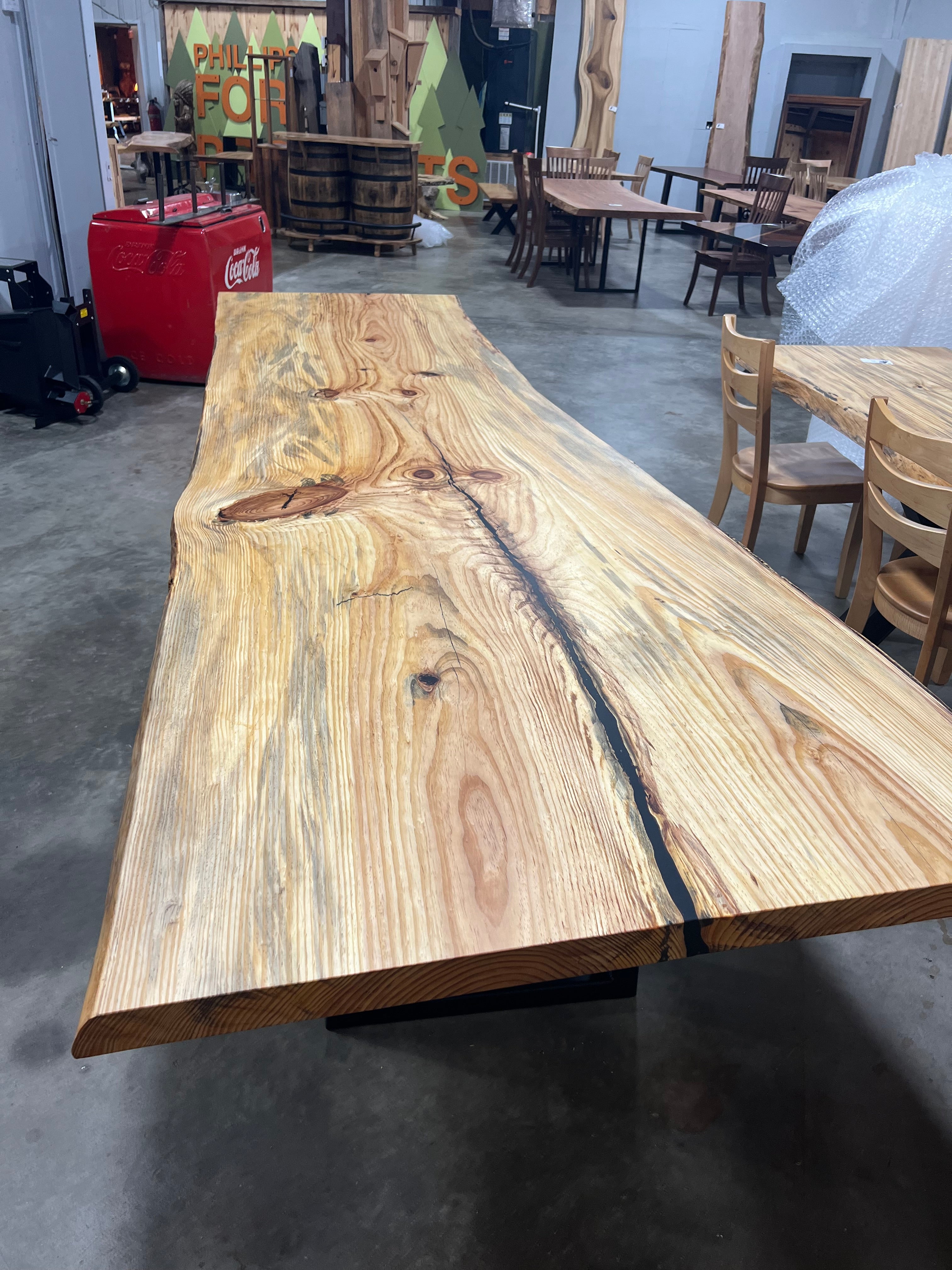 Finished live edge blue pine slab with natural grain and blue-gray streaks
