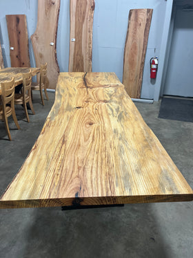 Finished live edge blue pine slab with natural grain and blue-gray streaks

