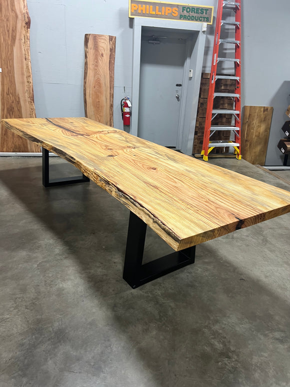 Finished live edge blue pine slab with natural grain and blue-gray streaks
