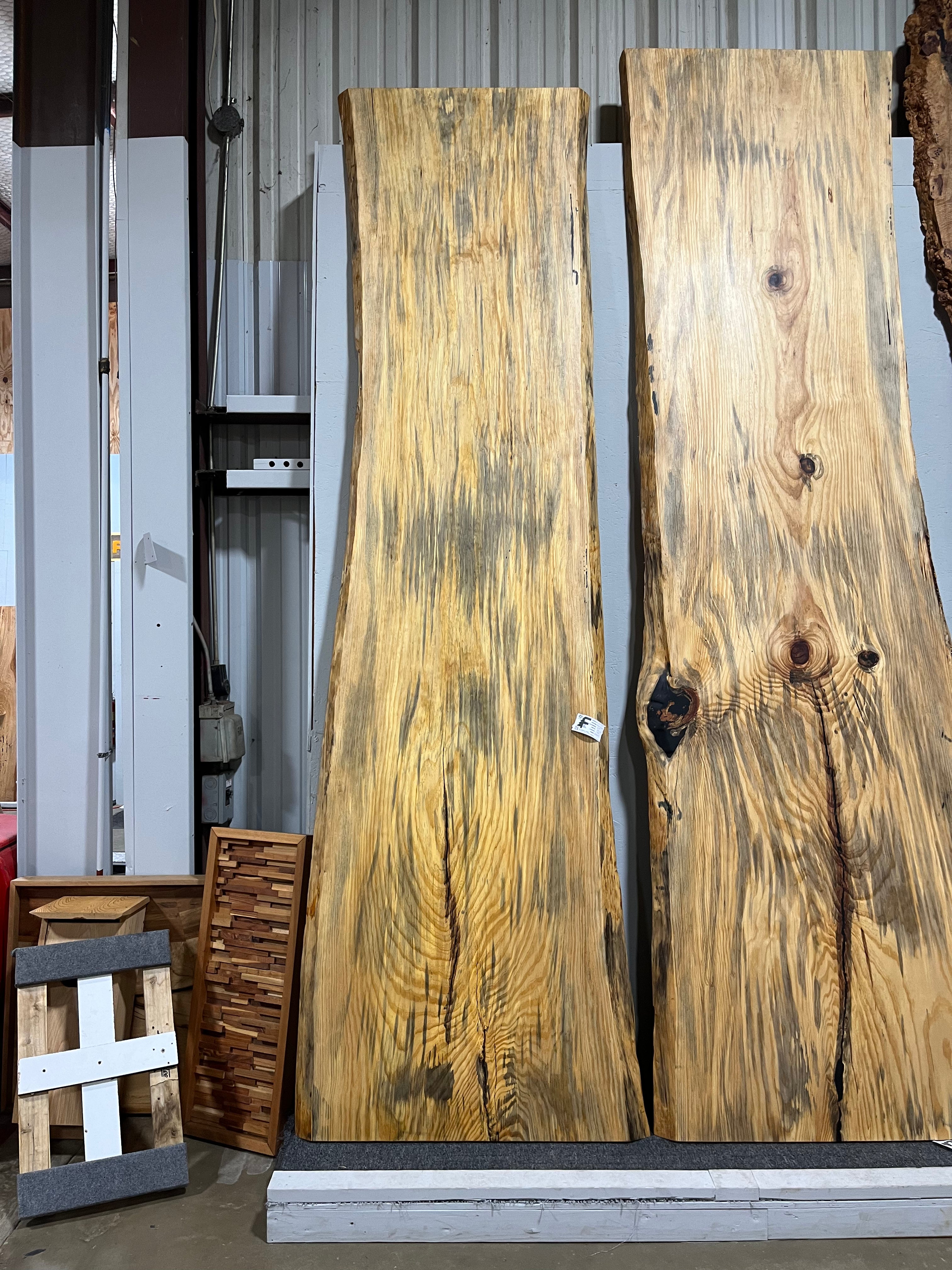 Finished live edge blue pine slab with natural grain and blue-gray streaks

