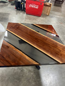 Modern walnut table with epoxy river detail and square edge finish
