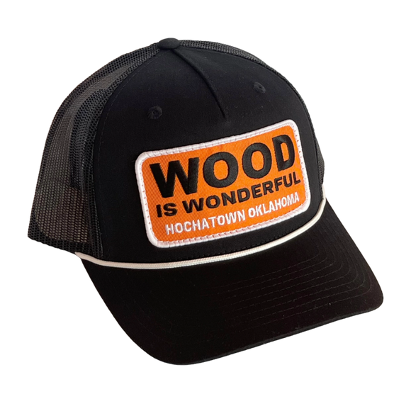 A black hat with a Wood is Wonderful Hochatown Oklahoma patch