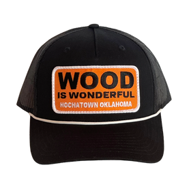 A black hat with a Wood is Wonderful Hochatown Oklahoma patch