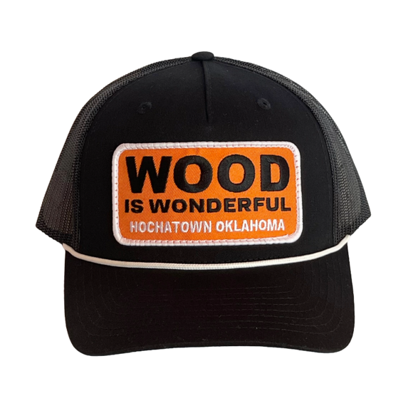 A black hat with a Wood is Wonderful Hochatown Oklahoma patch