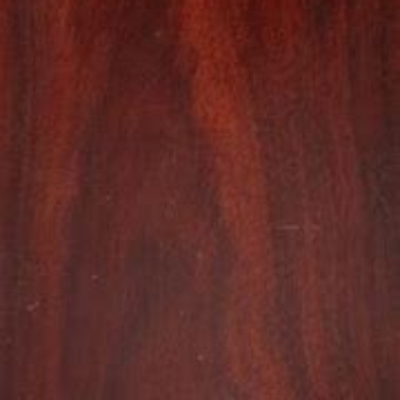 Close-up view of a piece of bloodwood lumber displaying its wood grain.