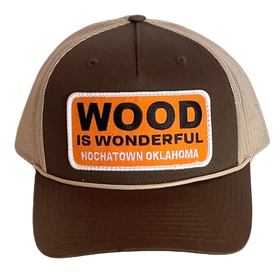 A brown and tan hat with a Wood is Wonderful Hochatown Oklahoma patch