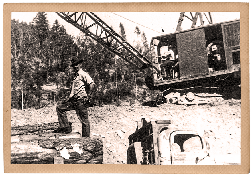 Cecil Phillips stands proud on the log crane he operated in Northern California.