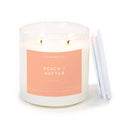 Candle with a peach label on a white background