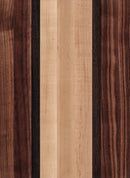 A wooden cutting board with a striped pattern of different shades of brown and beige.