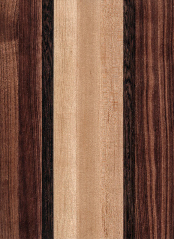 A wooden cutting board with a striped pattern of different shades of brown and beige.
