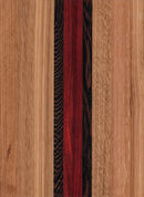 A wooden cutting board with a pattern of different wood shades and an engravable state outline.