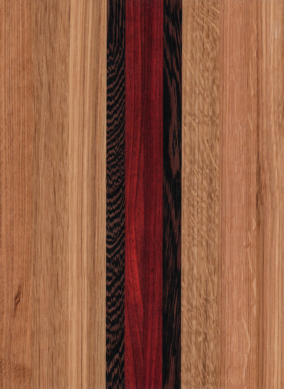 A wooden cutting board with a pattern of different wood shades and an engravable state outline.