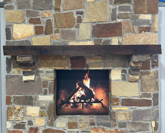 A beam style fireplace mantel, made from walnut wood, displayed on a rack.