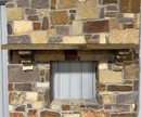 A beam style fireplace mantel, made from weathered ash wood, mounted on a stone wall.
