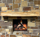 A live edge style fireplace mantel, made from pecan wood, mounted on a stone wall.