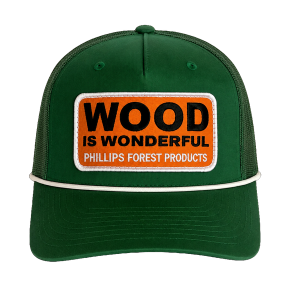 A kelly green hat with a Wood is Wonderful Phillips Forest Products patch