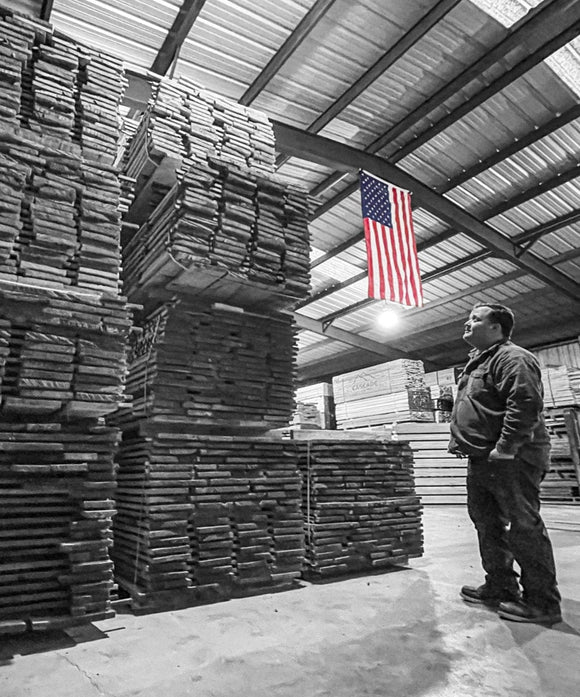 Cole Phillips inspects freshly kiln dried lumber. 