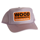 A lavender trucker hat with a Wood is Wonderful Hochatown Oklahoma patch