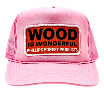 A light pink trucker hat with a Wood is Wonderful Phillips Forest Products patch