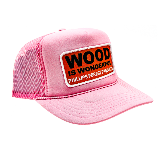 A light pink trucker hat with a Wood is Wonderful Phillips Forest Products patch