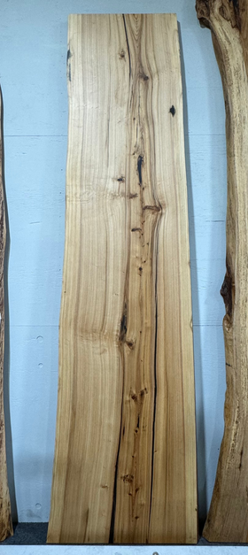 Natural cypress wood slab with rich grain patterns and live edge, perfect for custom dining tables or countertops