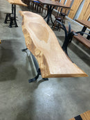 Live edge pecan slab with rich golden-brown tones, natural grain patterns, and organic edges