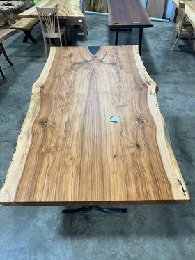 Live edge pecan slab with rich golden-brown tones, natural grain patterns, and organic edges