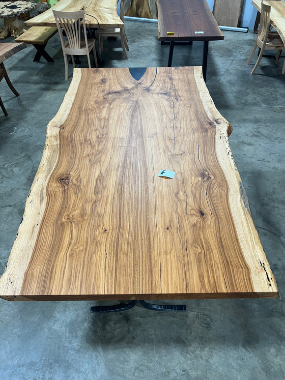 Live edge pecan slab with rich golden-brown tones, natural grain patterns, and organic edges
