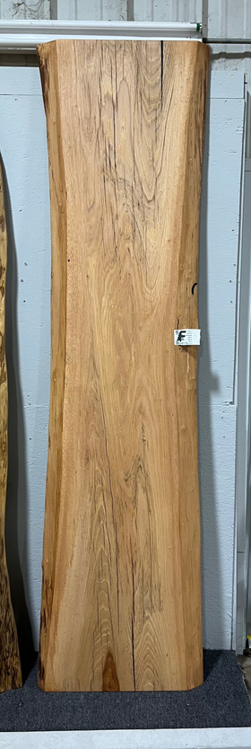 Live edge pecan slab with rich golden-brown tones, natural grain patterns, and organic edges