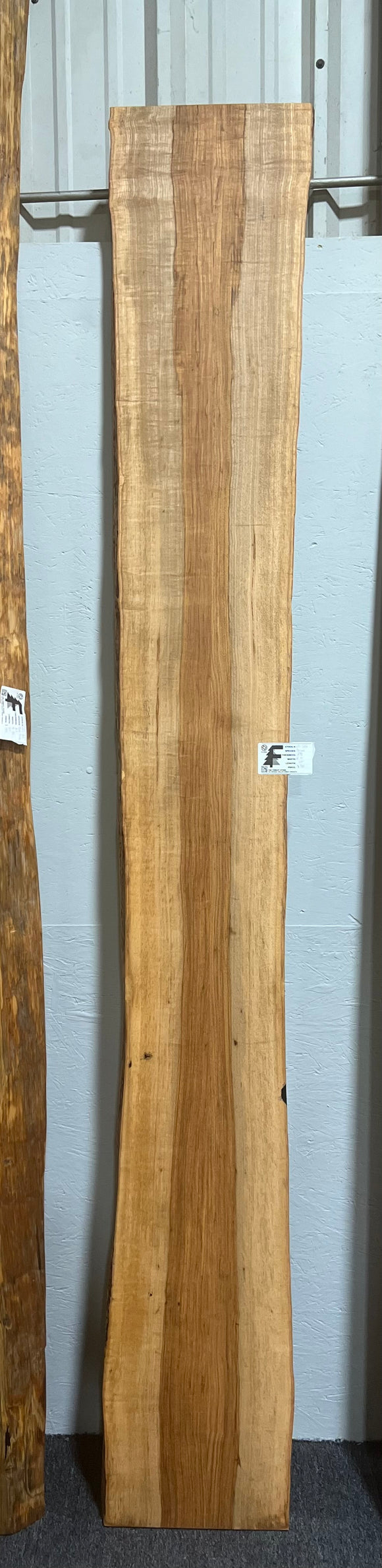 Live edge pecan slab with rich golden-brown tones, natural grain patterns, and organic edges
