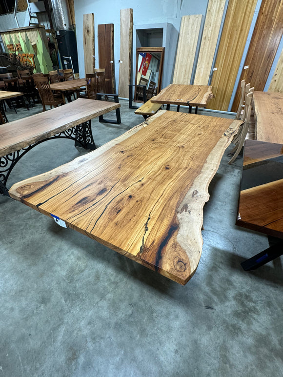 Live edge pecan slab with rich golden-brown tones, natural grain patterns, and organic edges
