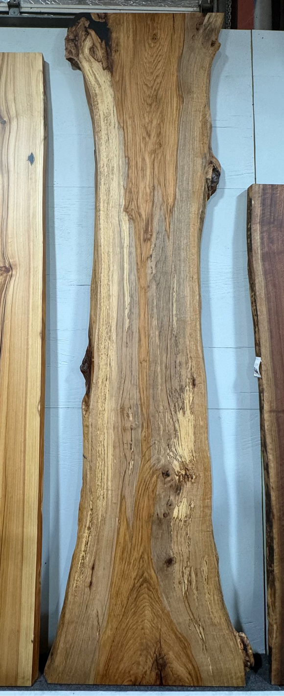 Live edge pecan slab with rich golden-brown tones, natural grain patterns, and organic edges
