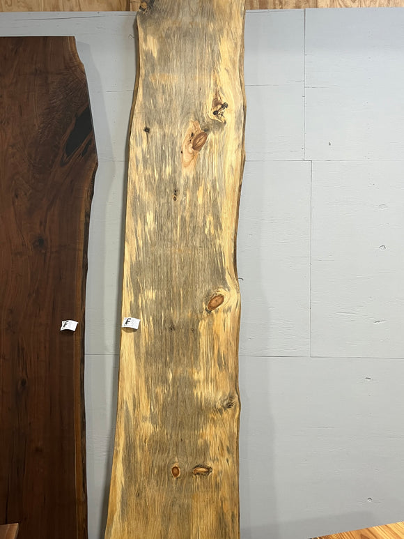 Finished live edge blue pine slab with natural grain and blue-gray streaks