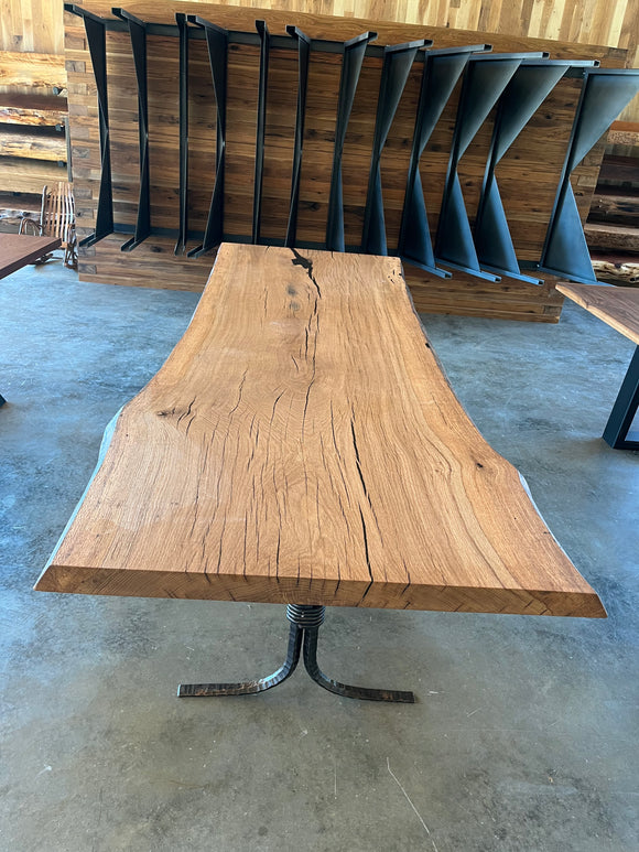 Close-up of a live edge post oak slab with natural grain and knots