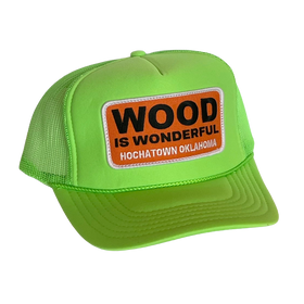 A neon green trucker hat with a Wood is Wonderful Hochatown Oklahoma patch