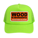 A neon green trucker hat with a Wood is Wonderful Hochatown Oklahoma patch