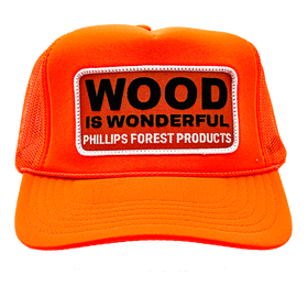 A neon orange trucker hat with a Wood is Wonderful Phillips Forest Products patch