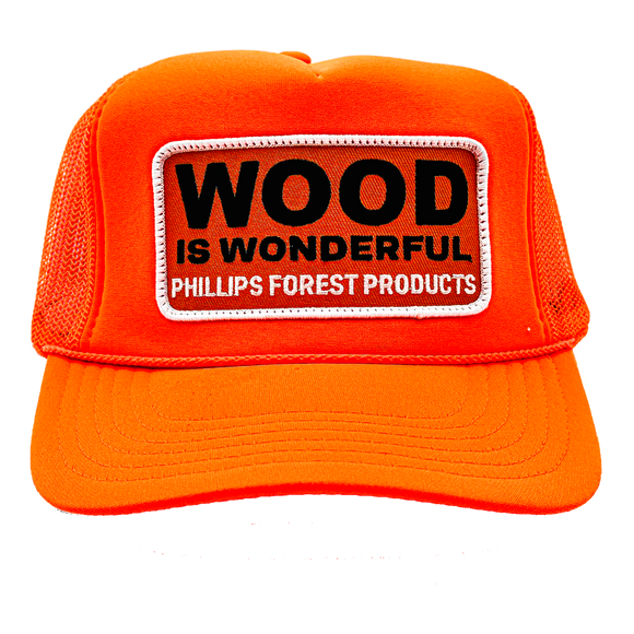 A neon orange trucker hat with a Wood is Wonderful Phillips Forest Products patch
