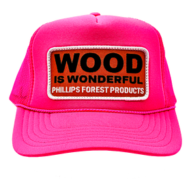A neon pink trucker hat with a Wood is Wonderful Phillips Forest Products patch