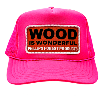 A neon pink trucker hat with a Wood is Wonderful Phillips Forest Products patch