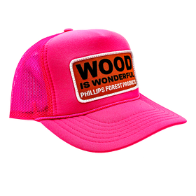 A neon pink trucker hat with a Wood is Wonderful Phillips Forest Products patch