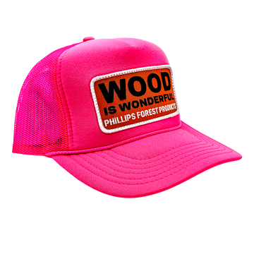 A neon pink trucker hat with a Wood is Wonderful Phillips Forest Products patch